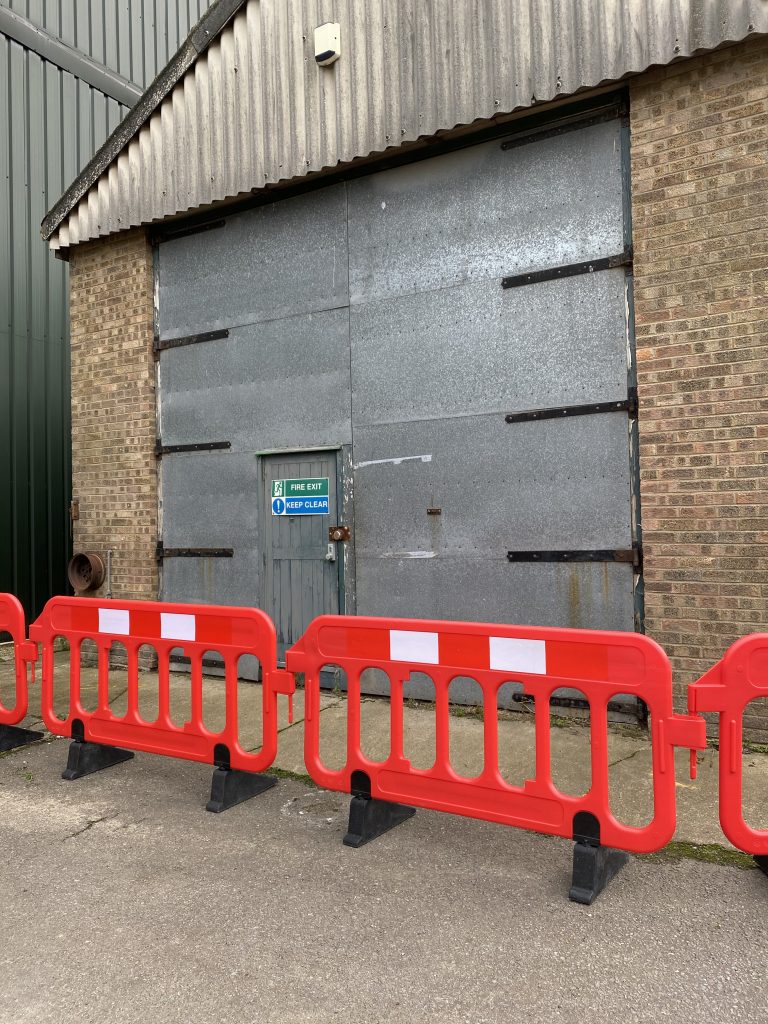 In stock red traffic barrier