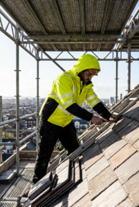OAKLINE The Kimi Hi Vis Jacket In Yellow - repairing a roof slate on a scaffold