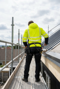 OAKLINE The Kimi Hi Vis Jacket In Yellow - working on a roof